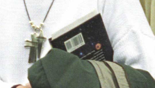 Close up of the book in Hillary Clinton's arm.  Click the image to go to a book cover comparrison.