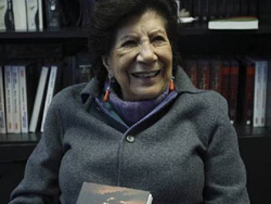 The 84-year old author Guadalupe Rivera holding her book.