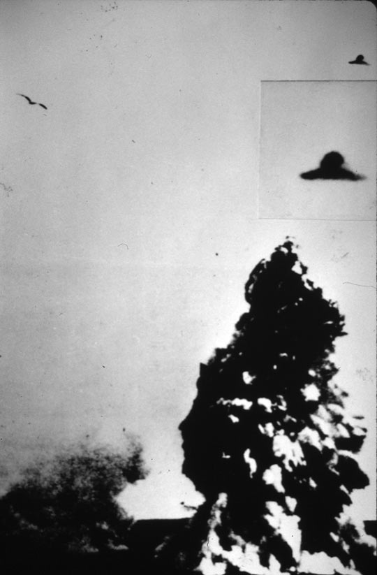 Flying disc next to an underwater volcanic eruption reportedly taken on Dec. 11, 1967 by a Navy officer at the Antarctic Station in Deception Is., leaked to the weekly magazine Siete Días. The disc on the top is the real size of the object; the second an enlargement. (image credit: ICUFON Archives)