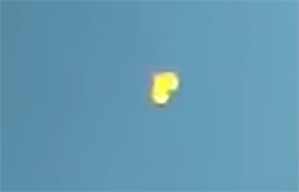 The witness first saw a silvery object hovering in the sky on June 17, 2016. Pictured: Cropped and enlarged still frame from witness video. (Credit: MUFON)