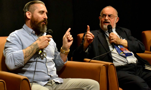 Jeremy Corbell (left) debating Bob Lazar with Stanton Friedman at the 2015 International UFO Congress. Click the image to see the debate. (Credit: Carlo Petrick)
