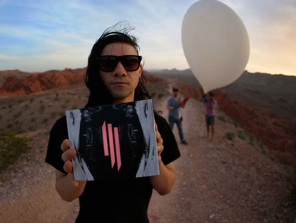 Promotional image of Skrillex with artwork that appears on one version of the phone cases. A baloon can be seen in the background, similar to the baloons used to capture satelite imagery. (Credit: PSFK)