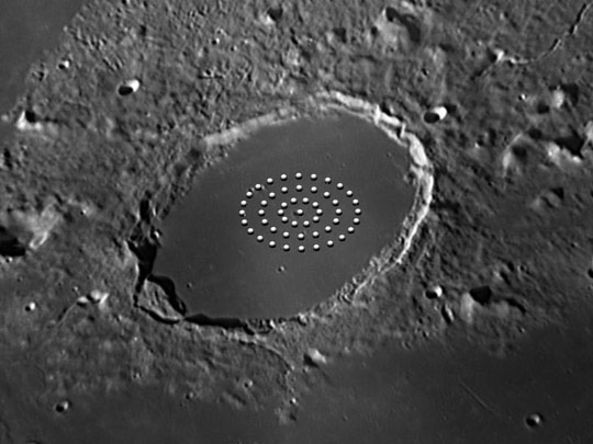 Illustration of bright dots seen on the moon crater Plato in 1877.