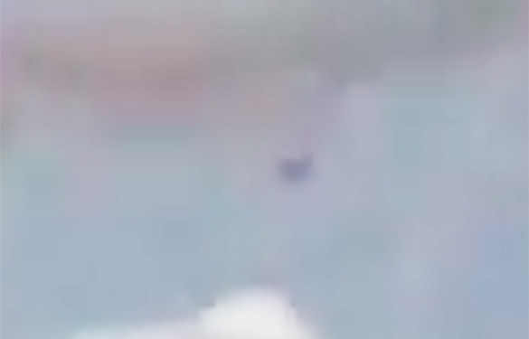 A square or rectangle-shaped UFO moved toward the witness on June 5, 2016. Pictured: Cropped, enlarged and enhanced still frame from the witness video. (Credit: MUFON)