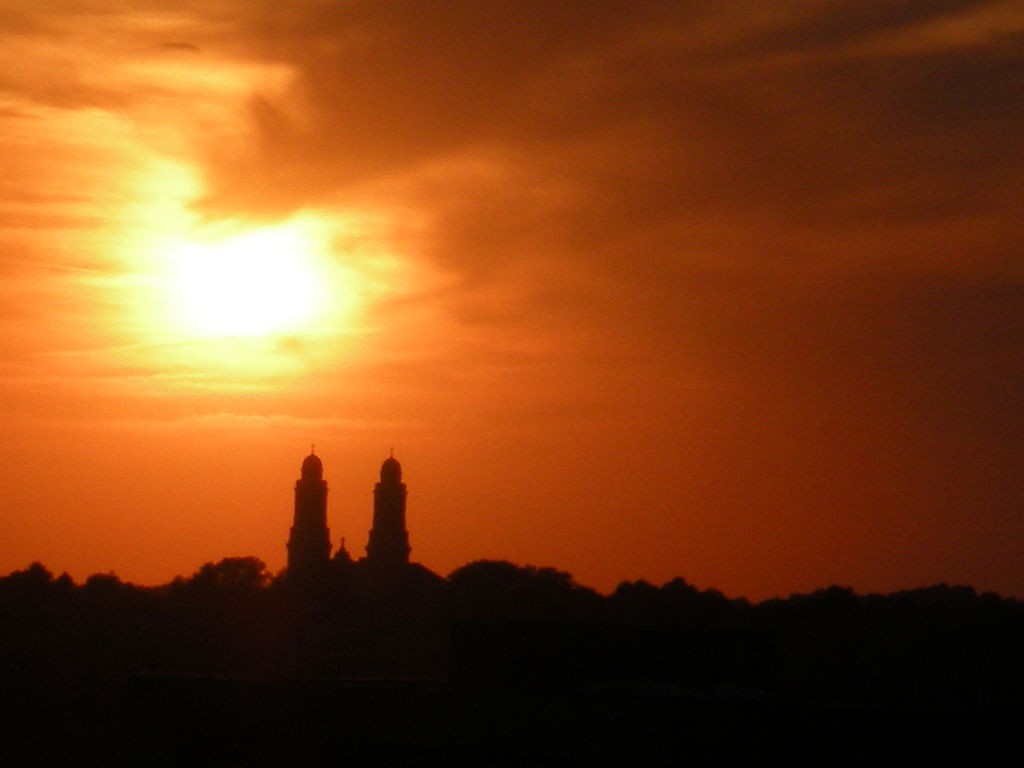 One of the cigar-shaped objects moved out of formation during the sighting. Pictured: The Saint Cecilia Cathedral against an Omaha summer sunset. (Credit: Wikimedia Commons)