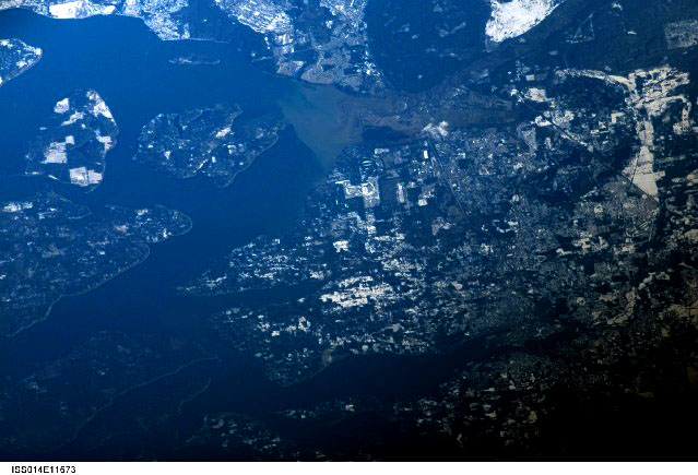 As the object moved away, it appeared to release bright flashes of light. Pictured: Olympia, WA, as seen from the International Space Station. (Credit: Wikimedia Commons)