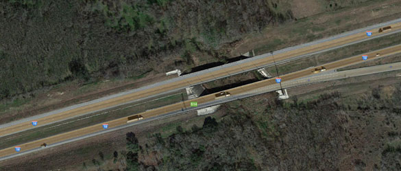 The trucker felt the intense heat as he drove under the objects. Pictured: The mile marker 614 area. (Credit: Google Maps)
