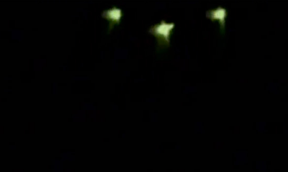 Picture taken by Nikita Tomin showed three green-shaded lights on a 'UFO' flying above the resort in Irkutsk region. (Credit: Baikal Press/NTV/The Siberian Times)