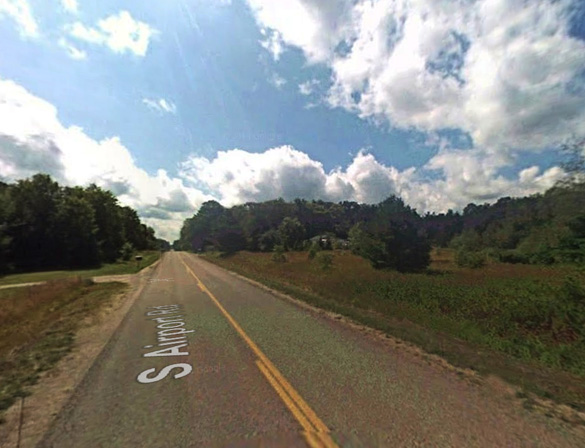 The witness first saw the disc-shaped object while driving his dirt bike home from work along South Airport Road, pictured, when he panicked and began heading home. The object followed. (Credit: Google)