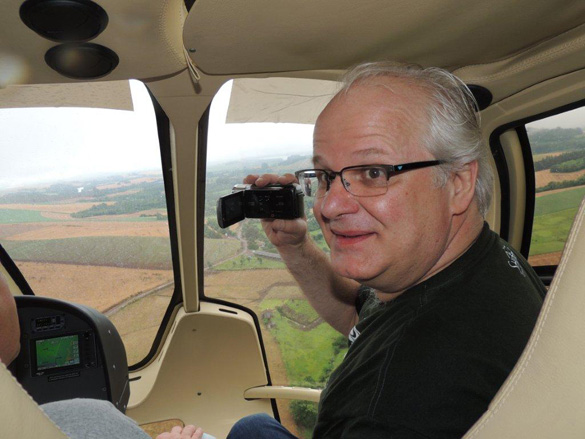 A.J. Gevaerd in a helicopter filming the crop circles. (Credit: Brazilian UFO Magazine)