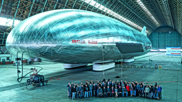 Worldwide Aeros Corp. employees pose with their massive aircraft. It took 4 years to build. (Credit: Worldwide Aeros Corp.)