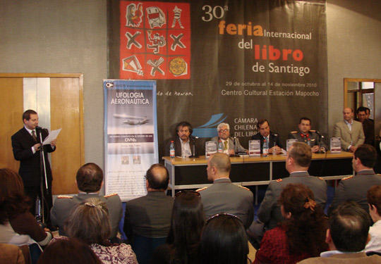 The launching of the book at the Santiago Book Fair; seated on the table (from right to left): Capt. Rodrigo Bravo, Gen. Ricardo Bermúdez, director of CEFAA, Juan Castillo. (image credit: Mario Valdes)