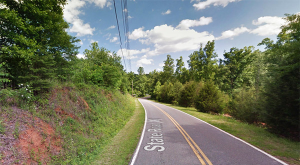 The North Carolina witness was driving along this stretch of Montford Cove Road north of Union Mills when an object the 'size of a large storage shed' moved toward ground level. (Credit: Google)