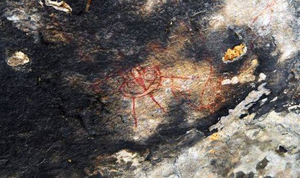 A rock painting that looks similar to a UFO with three legs. (Credit: Amit Bhardwaj/The Times of India)