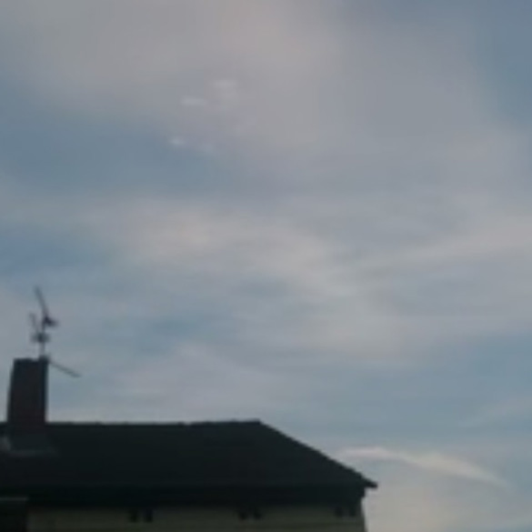 These bright spots in the clouds are what the witness believes to be UFOs. (Credit: Andrzej Duraj/YouTube)