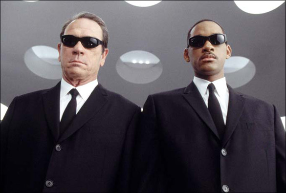 Actors Tommy Lee Jones (left) and Will Smith as Men in Black. (Credit: Columbia Pictures)