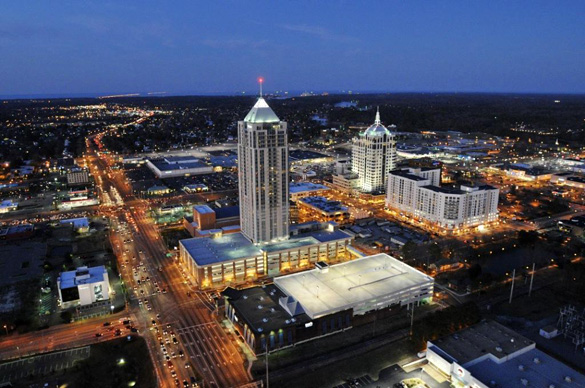 Picture of the Virginia Beach Town Center at night. The Westin Hotel building can been seen in the center. It is the largest building in Virginia. (Credit: UniqueHomes.com)