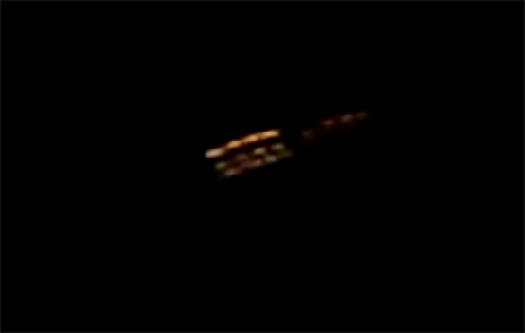 The witness said the object was a reddish-white color and disc-shaped. Pictured: Cropped and enlarged portion of the witness video. (Credit: MUFON)