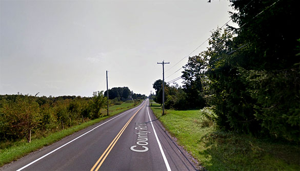 The witness was driving along Elmer Hill Road in Rome, NY, pictured, when he first thought an airplane was flying nearby at the treetop level. (Credit: Google)