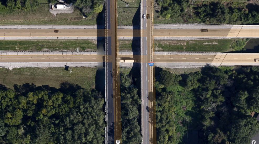 As the object moved away, the witness described the back of the object as having a rectangular panel of solid, bright, red lights made up of 6 to 8 smaller panels butted together. Pictured: Intersection of Route 475 and the Ohio Turnpike. (Credit: Google)