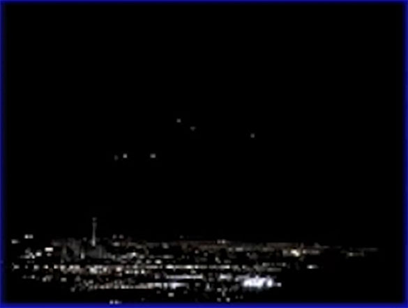 Eventually six lights appeared to hover in the sky. Pictured: Still image cropped and enlarged from the witness video. (Credit: MUFON)