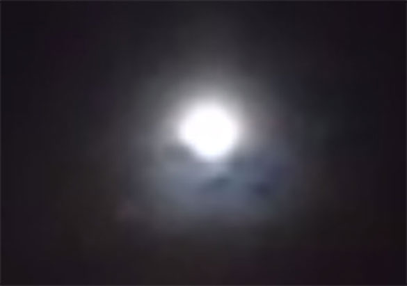Cropped and enlarged still frame from witness video. At one point in the video, the group wonders what the black blotches are below the moon. (Credit: MUFON)