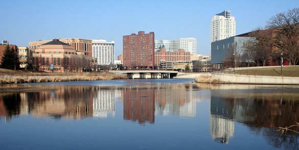 Downtown Rochester reflected in the Zumbro River. (Credit: Wikimedia Commons)