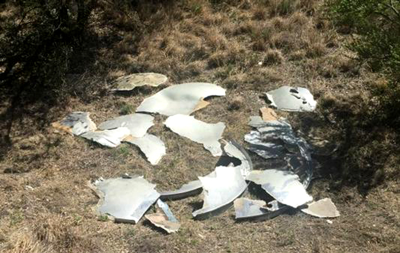 Photo of the UFO in pieces on the side of the highway. (Credit: Roswell Police Department) 